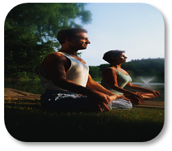Photograph of couple practicing yoga