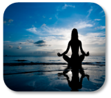 Image of girl practicing yoga on the beach at sunset