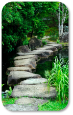 Image of large stone path surrounded by water